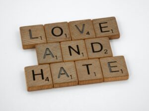 scrabble tabs spelling out Love, and Hate